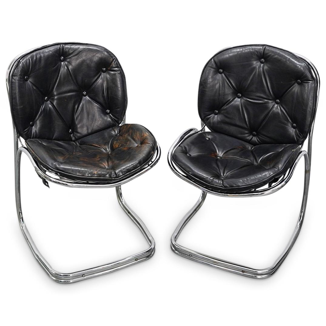 Pair of Gastone Rinaldi Style Chrome Chairs: DESCRIPTION: Pair of Gastone Rinaldi style chrome chairs with vinyl cushion seats. CIRCA: Mid 20th Century ORIGIN: USA DIMENSIONS: H: 32.5" x W: 9.5" x Seat Depth: 19.5" - CONDITION: Wear to cushions,