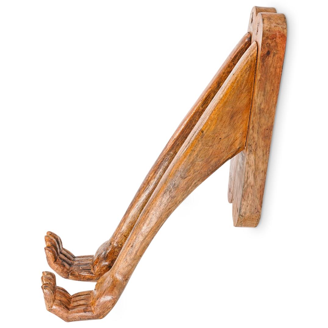 Pair Pedro Friedeberg Style Wood Hand Sconces: DESCRIPTION: Pair of Pedro Friedeberg-style carved wooden hand sconces, each depicting a forearm and curved hand. CIRCA: Mid 20th Century ORIGIN: American DIMENSIONS: H: 26.25" W: 3.25" Depth: 17.25" 