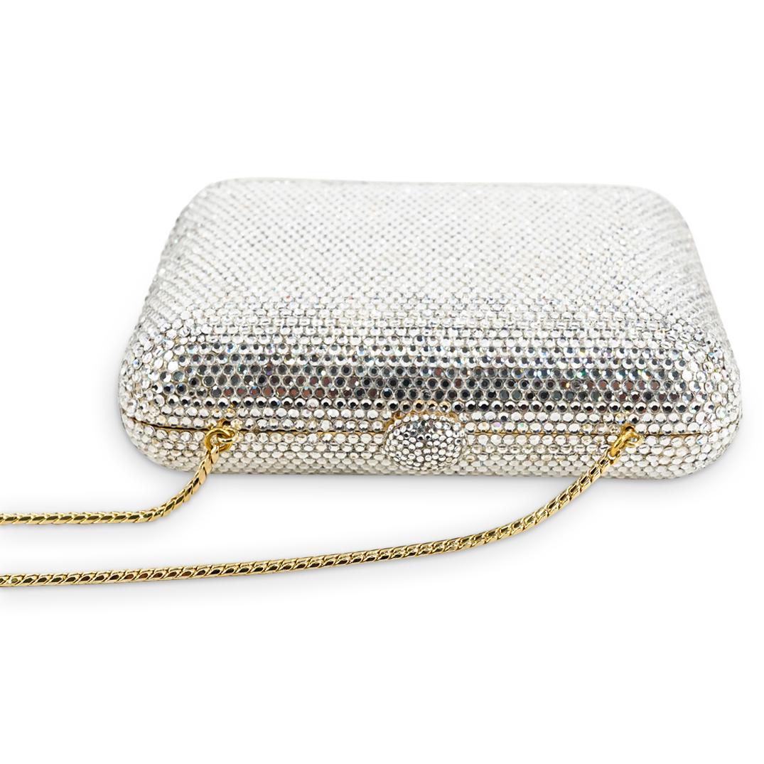 Judith Leiber Gilt And Bejeweled Clutch W/ Comb, Compact: DESCRIPTION: Judith Leiber clutch featuring a bejeweled exterior which opens to reveal a gilt leather interior containing a strap and a matching comb and compact. Each piece is branded "Judith Leiber"