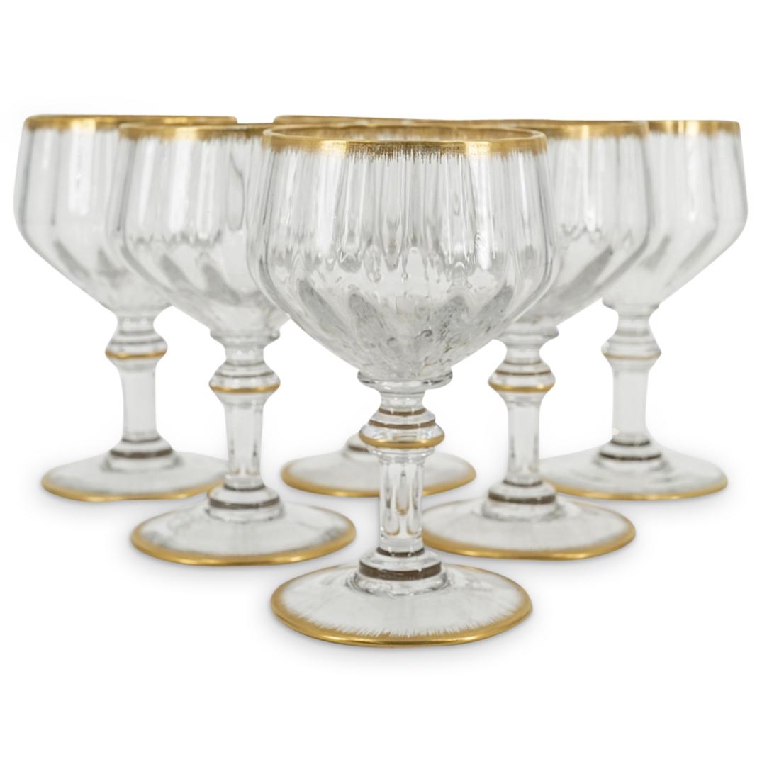(6 Pc) Daum Nancy Ribbed Vintage Sparkling Wine Glasses: DESCRIPTION: Six Daum Nancy wine glasses, each featuring a ribbed bowl and decorated with gilt accents around the lip, stem, and foot. Each piece is marked on underside "DAUM NANCY FRANCE". CIRCA: 20t