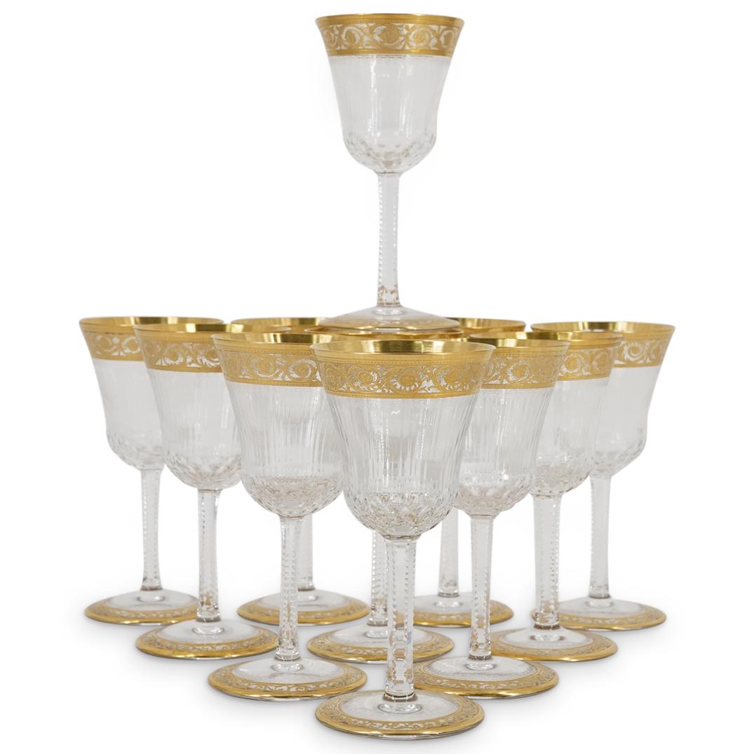 (11 Pc) Antique St. Louis "Thistle" Claret Wine Glasses Set: DESCRIPTION: (11 Pc) An antique St. Louis "Thistle" stemware claret wine glasses set. Features a gold encrusted pattern, notched texture, and multi sided stem ribbed bowl, decorated with gilt ornate o