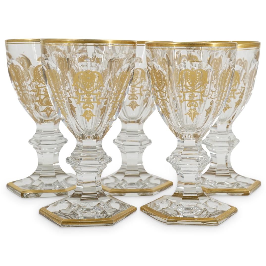(5 Pc) Baccarat Empire Crystal White Wine Glasses: DESCRIPTION: Five Baccarat crystal white wine glasses, each featuring a faceted bowl and a hexagonal foot. Each piece is decorated with the Ã¢€Å“EmpireÃ¢€Â pattern of gilt foliage de