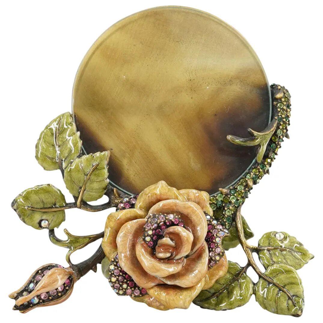Jay Strongwater Crystal Enamel Floral Frame: DESCRIPTION: Jay Strongwater swarovski crystal inset frame with enameled floral design. Marked: "Jay Strongwater" CIRCA: 20th Cent. ORIGIN: USA DIMENSIONS: (Frame) D: 4" (Picture) D: 2.25" Have a simi