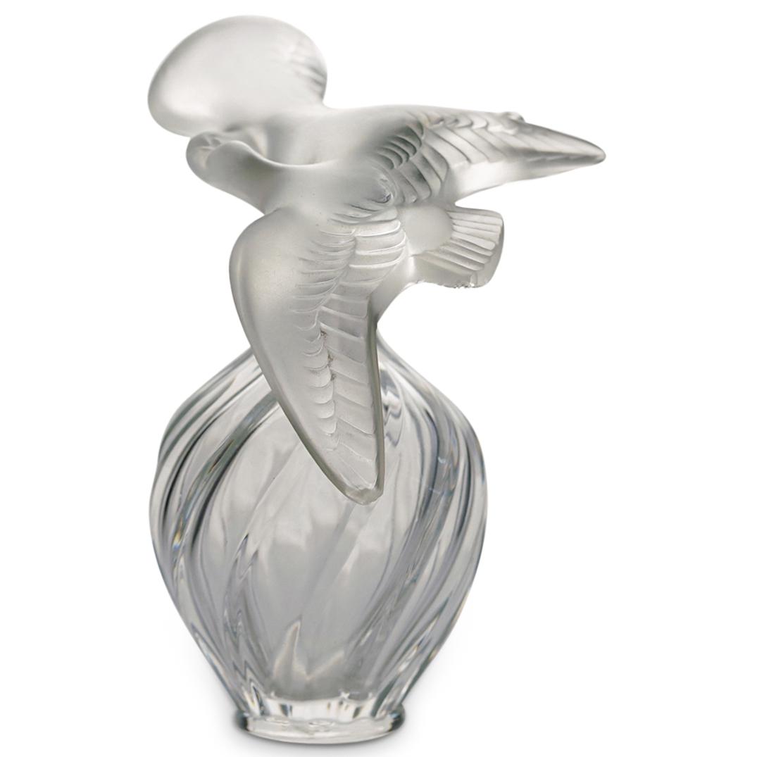 Lalique "L'air du temps" Perfume Bottle: DESCRIPTION: Lalique "L'air du temps" glass perfume bottle with frosted double dove stopper. Marked at underside: "Lalique, Nina Ricci" CIRCA: 20th Cent. ORIGIN: France DIMENSIONS: H: 4" x D: 3.25" Ha