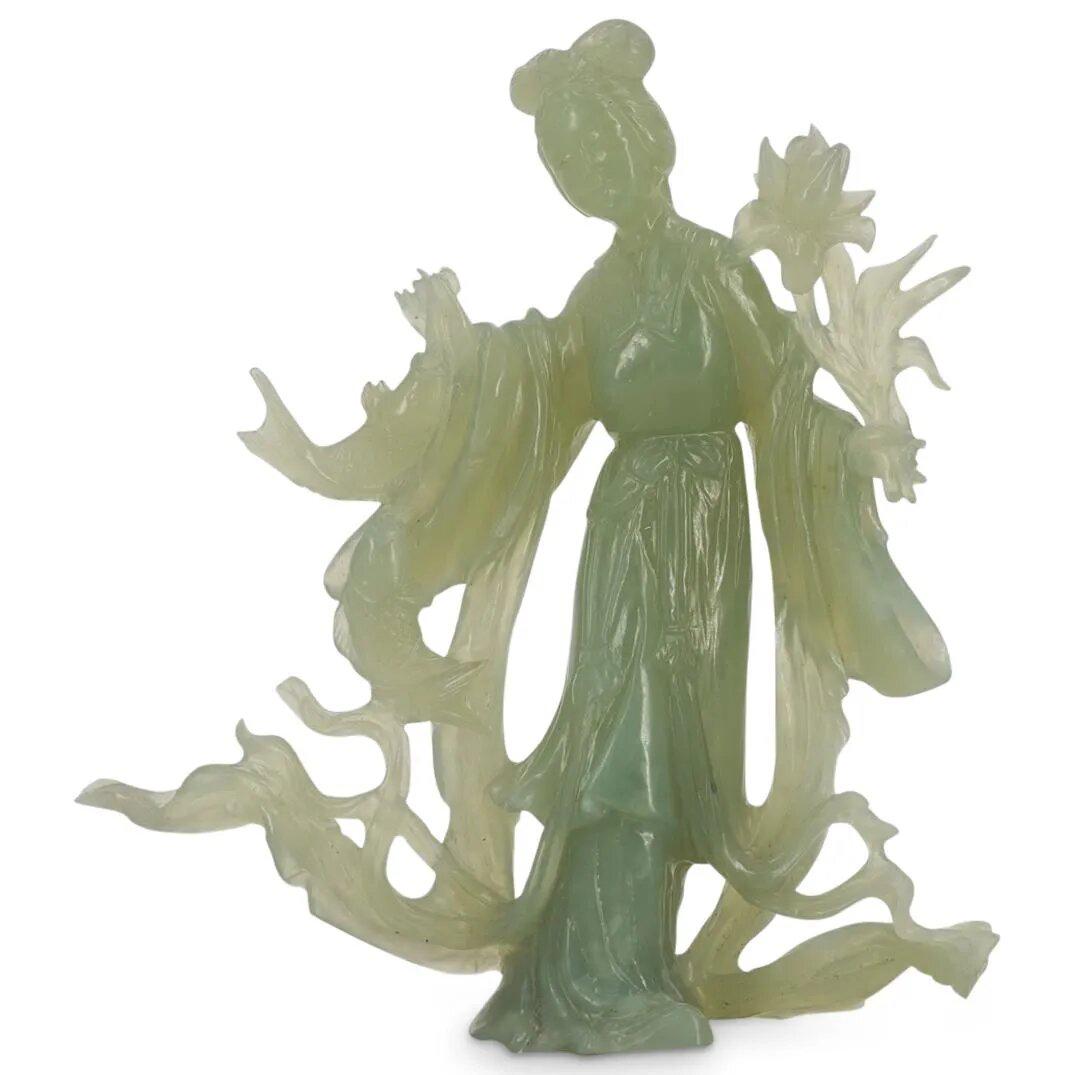 Chinese Carved Jade Guan Yin Sculpture: DESCRIPTION: Carved jade open-work sculpture depicting Guanyin holding a lotus in her left hand and a rope of fish in her right. CIRCA: 19th Century ORIGIN: China DIMENSIONS: H: 7.75" W: 2" L: 7" Have