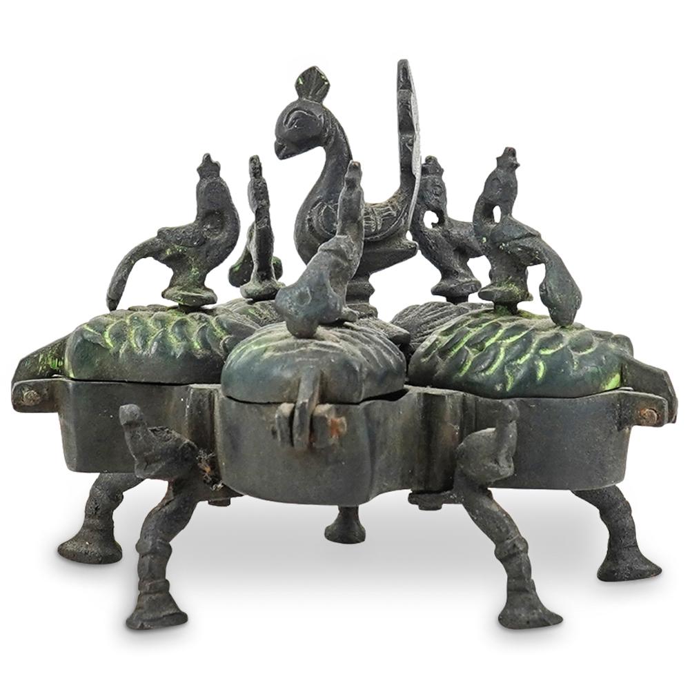 Indian Hindu Iron Tika Box: DESCRIPTION: An Indian Hindu iron Tika box with center peacock finial surrounded by smaller peacock handles, raised on five hoof legs.CIRCA: Early to Mid 20th CenturyORIGIN: IndiaDIMENSIONS: H: 3.5" x