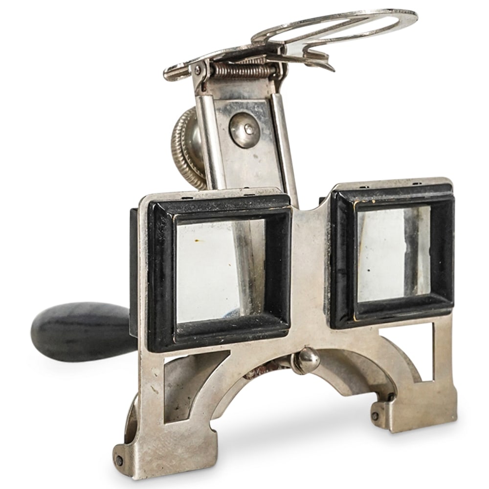 Vintage Optometrist Optical Trial Lenses: DESCRIPTION: Vintage Optometrist optical trial lenses with metal frame and wooden handle. CIRCA: Early 20th Century DIMENSIONS: H: 4" W: 5 1/2" CONDITION: With signs of use and age. Removable handle.