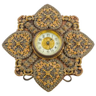 Antique English Desk Clock: DESCRIPTION: Antique English desk clock having a figural floral design with gilt metal filigree and cannetille Victorian design by The British United Clock Company, Birmingham England. Marked on verso