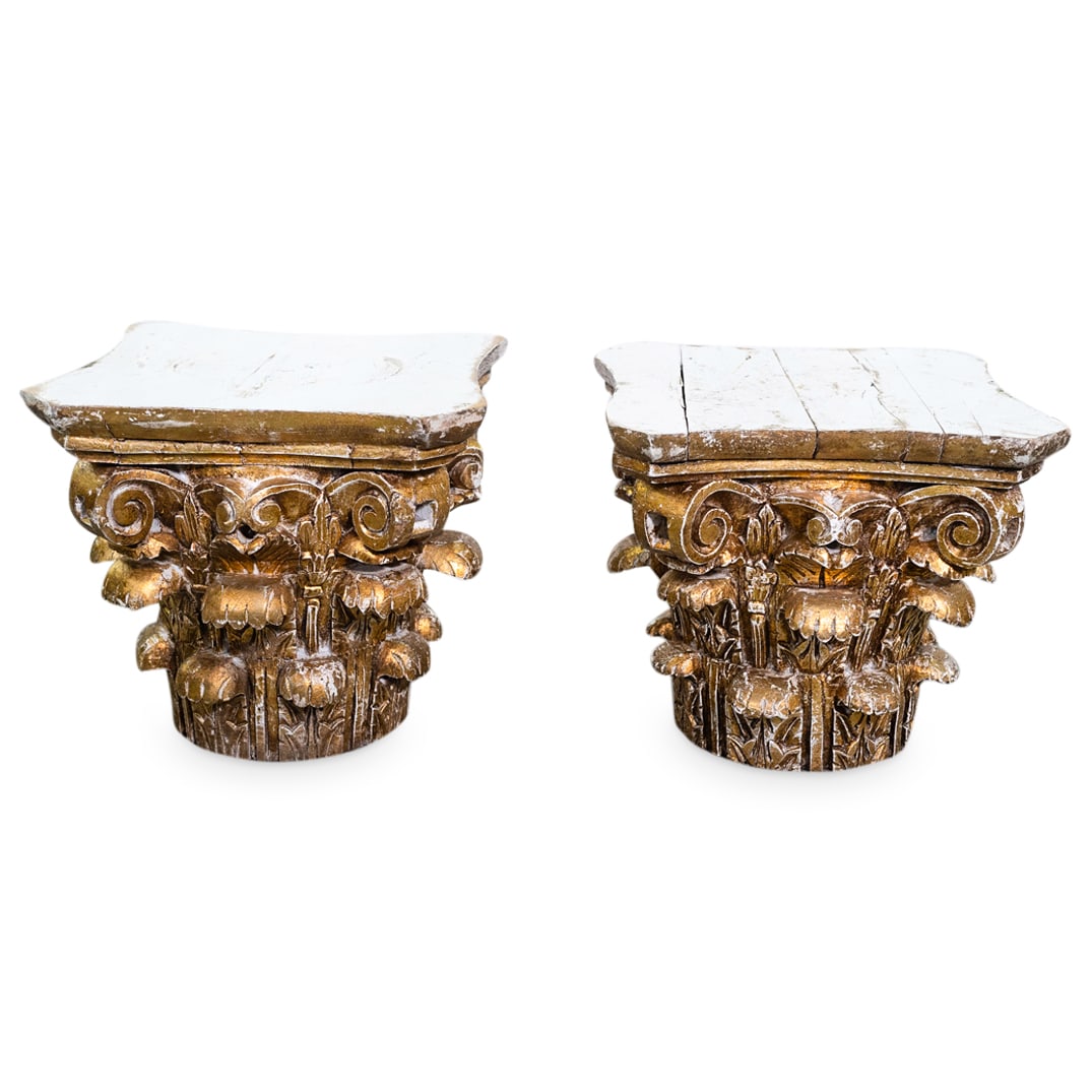 Antique Italian Hand Carved Wood Capitals: DESCRIPTION: (2 Pc) Pair of Italian antique hand carved wood ornamental capitals with gold gilt finishes and white paint patina. CIRCA: Late 19th Century DIMENSIONS: H: 13" W: 15" D: 15" CONDITION: Da