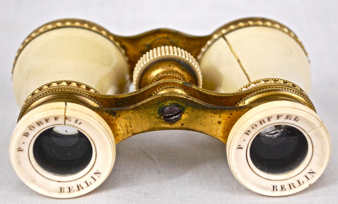Antique Ivory and bronze binoculars from Berlin: DESCRIPTION: Antique Ivory and bronze binoculars from Berlin. Extreme detailed work in the carving. CIRCA: 1900s MADE IN: Berlin, Germany DIMENSIONS: 4 1/2" x 2 1/2"