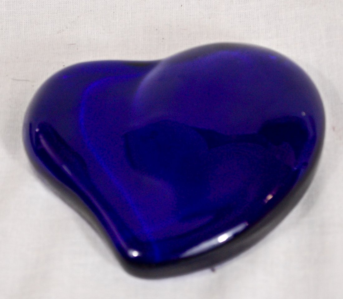 Tiffany and Co. Heart shaped blue paperweight.: DESCRIPTION: Tiffany and Co. Heart shaped blue paperweight. Made of died glass. CIRCA: 1900's MADE IN: USA DIMENSIONS: