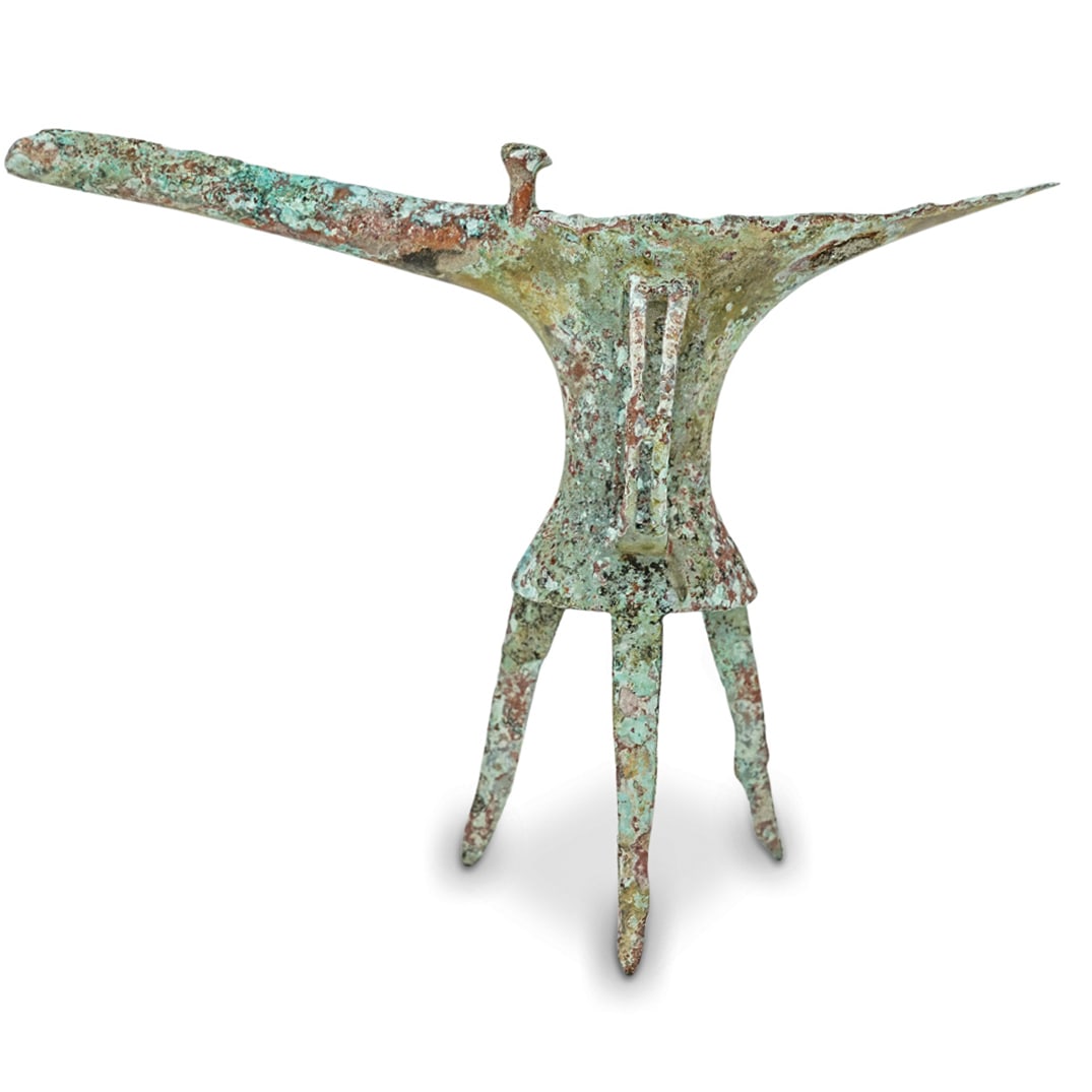 Ancient Chinese Erlitou Culture Bronze Jue Tripod Wine Vessel: DESCRIPTION: Bronze 'Jue' - Tripod Wine Vessel of the Chinese Bronze Age from the Erlitou Culture in the Yellow River Valley. Piece is extraordinarily rare, predates the Shang Dynasty, and is from the