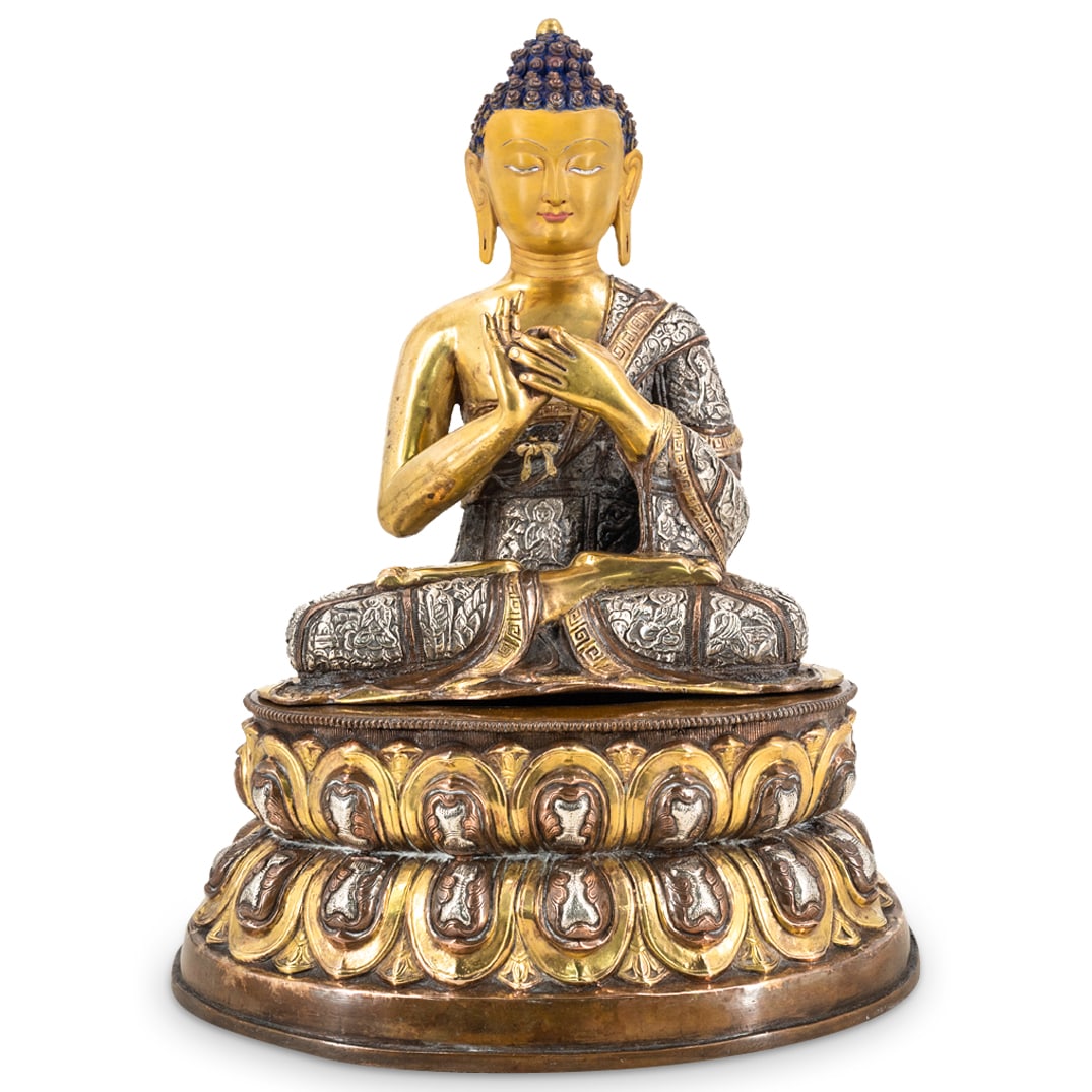 Antique Tibetan Gilt Bronze Gautama Buddha: DESCRIPTION: Bronze sculpture of Siddhartha Gautama seated on a double lotus throne in the vajra posture while wearing his hair in an ushnisha ("topknot") and making the gesture for "turning the wheel