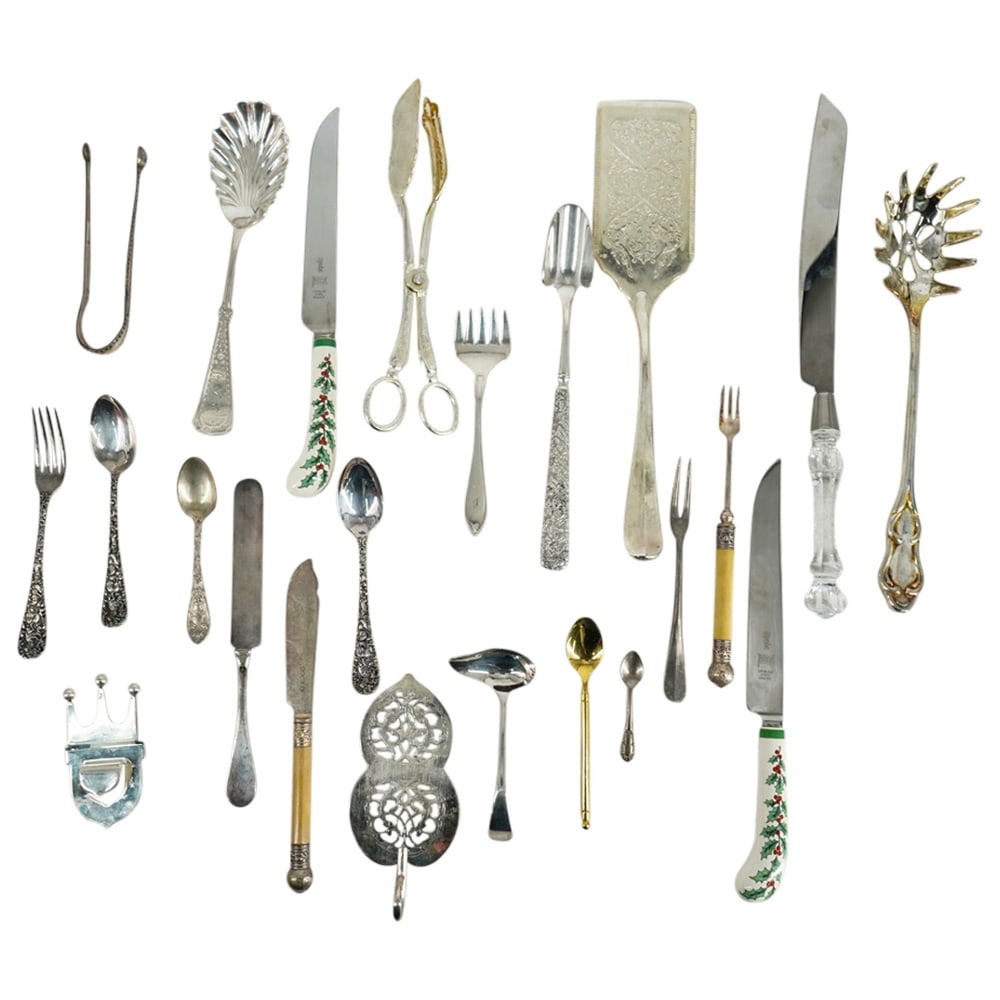 (24 Pc) Assorted Silver Plated Assorted Flatware: DESCRIPTION: (24 Pc) Assorted silver plated flatware and serving utensils. Includes the following items: (1 Pc) Vintage Wallace And Sons Silver Plated Embossed Repousse Cheese Scoop. L: 9”. (2 P