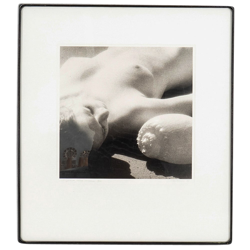 Nina Rizzo (20th C.) "Dreams Of The Sea" Photo: DESCRIPTION: Erotic monochrome photograph entitled "Dreams of the Sea" by Nina Rizzo depicting a nude woman reclining with a seashell. Signed and dated at lower right and titled at lower left. Mounted