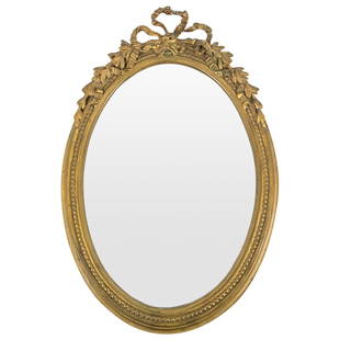 Antique French Gilt Carved Wood Mirror: DESCRIPTION: Antique mirror mounted in a gilt, carved wood frame crowned with an open-work bow flanked by fruitful foliage. CIRCA: 20th Century ORIGIN: France DIMENSIONS: H: 14.5" W: 1.75" L: 10" - CO