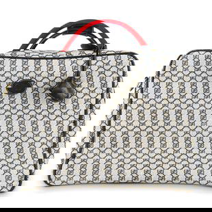Vintage Gucci Overnighter Travel Luggage Bag: DESCRIPTION: Vintage Gucci printed monogram canvas suitcase overnighter luggage bag with blue leather accents and gold tone hardware. With Gi CIRCA: 20th Century DIMENSIONS: H: 7" W: 18" L: 13" CONDIT