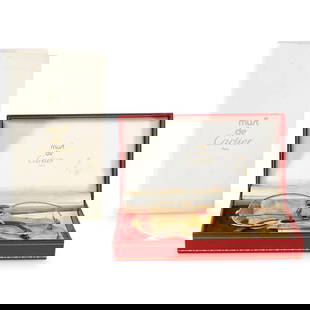 Cartier Bifocal Glasses In Box And Sleeve: DESCRIPTION: Vintage Cartier bifocal glasses featuring a gilt frame. Includes leather sleeve, box, and documentation. CIRCA: 20th Century ORIGIN: France DIMENSIONS: (Glasses) H: 2" W: 0.75" L: 5.5" (B