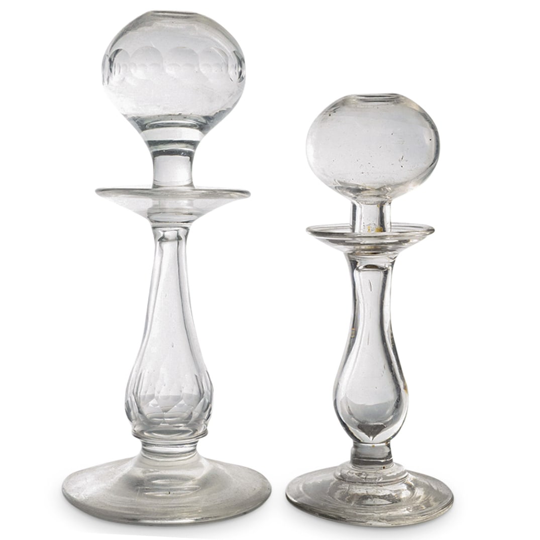 (2 Pc) Antique Lace Maker's Oil Lamps: DESCRIPTION: Two antique glass lacemakers oil lamps, one featuring facets. CIRCA: Late 19th - Early 20th Century DIMENSIONS: (Faceted lamp) H: 9.75" Diameter: 4.25" (Smooth lamp) H: 8.25" Diameter: 3.
