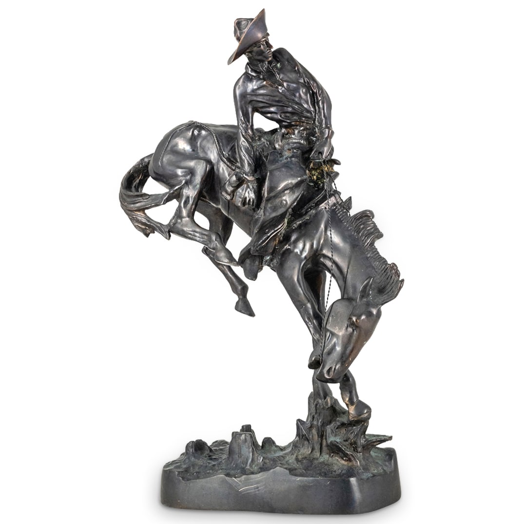 After Remington "Outlaw" Bronze Sculpture: DESCRIPTION: After Fredrick Remingingtons "Outlaw" sculpture depicts a seasoned outlaw riding his horse, finished with a dark patina, signed at the base. CIRCA: 20th Century DIMENSIONS: H: 22" W: 13" 