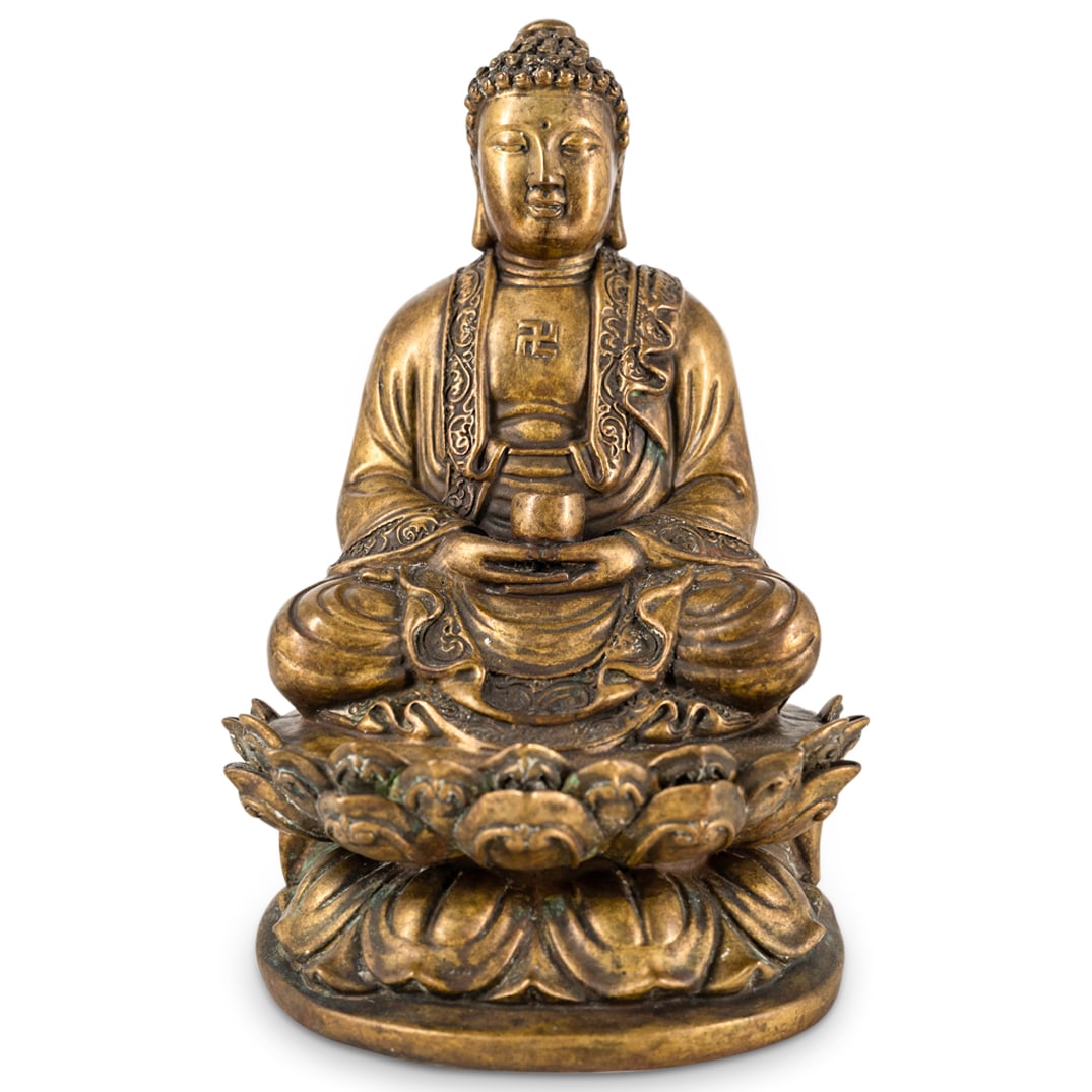 Chinese Bronze Buddha on Lotus Base: DESCRIPTION: a Chinese bronze buddha sculpture depicts a Gautama Buddha seated atop of a lotus flower base, holding a cup and decorated with buddhist swastika symbol. Provenance: From Estate of Willia
