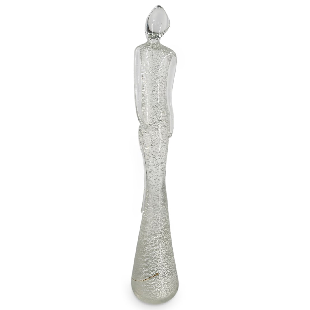 Murano Art Glass Figural Sculpture: DESCRIPTION: Murano art glass sculpture depicting a figure. CIRCA: 20th Century ORIGIN: Italian DIMENSIONS: H: 20.25" Diameter: 3.75" - CONDITION: Minor scratches near base. See lot description for de