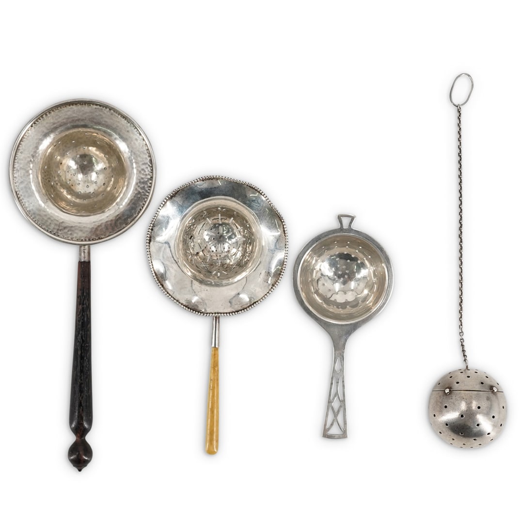 (4Pc) Antique Sterling Tea Strainers: DESCRIPTION: (4Pc) Antique sterling silver tea strainer grouping. Features: (1) Pierced ball and chain tea strainer. Hallmarked: "Sterling" (L: 9" x D: 1.75") (1) Bailey Banks & Biddle Co. sterling an