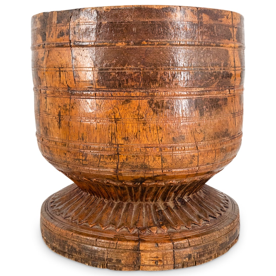 Vintage European Carved Wooden Cachepot: DESCRIPTION: Vintage carved wood cachepot featuring a rugged aesthetic accented by a ribbed, pointed skirt around the foot. CIRCA: 20th Century ORIGIN: European DIMENSIONS: H: 12.5" D: 12" - CONDITION