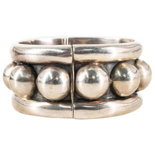 Vintage Modernist Sterling SIlver Mexican Bracelet: DESCRIPTION: A Vintage Sterling Silver bracelet featuring in a modernist design with repeated spherical patterns along the center frame, stamped on the inner band "Mexico 925 HOB". Total Weight:118 Gr