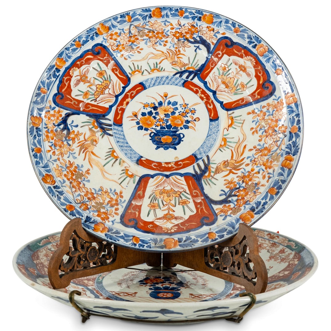 (2 Pc) Chinese Imari Porcelain Chargers: DESCRIPTION: (2 Pc) Chinese Imari porcelain chargers, decorated with a hand painted central motif depicting a porcelain vase with a floral bouquet and further decorated with cartouches of pheasants am