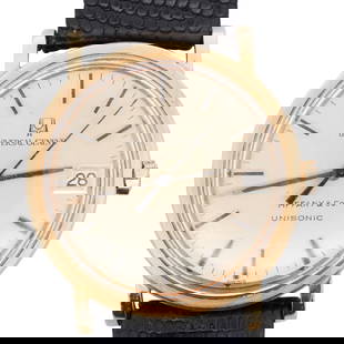 Vintage Universal Geneve Tiffany & Co. Unisonic 18k Gold Watch: DESCRIPTION: A Vintage Universal Geneve and Tiffany 18k gold watch, features a quartz movement, champagne dial reading (Universal Geneve Tiffany & Co Unisonic), gold and black hands with an acrylic ca