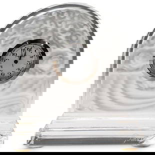 Baccarat Crystal Small Dome Mantle Clock: DESCRIPTION: Baccarat crystal small dome mantle clock in clear crystal with etched motifs on verso. Marked with Baccarat signature. CIRCA: 20th Century ORIGIN: France DIMENSIONS: H: 3 1/8" W: 2 3/4" C