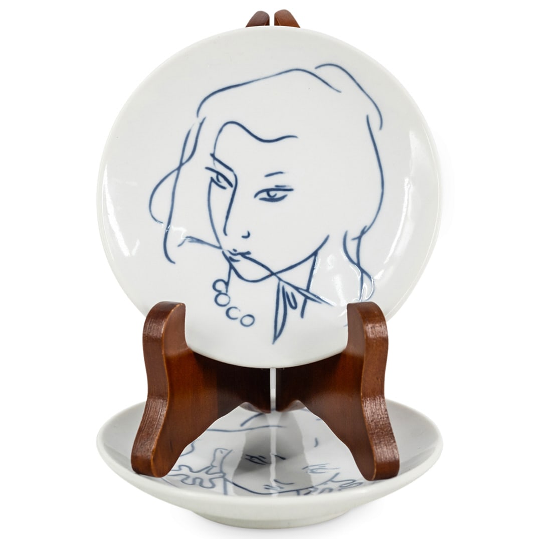 (2 Pc) Johannes Hedegaard For Royal Copenhagen Porcelain Saucers: DESCRIPTION: Two vintage porcelain saucers by Johannes Hedegaard for Royal Copenhagen, each depicting the head of a woman and each hallmarked on underside. CIRCA: 1956; 1957 ORIGIN: Danish DIMENSIONS: