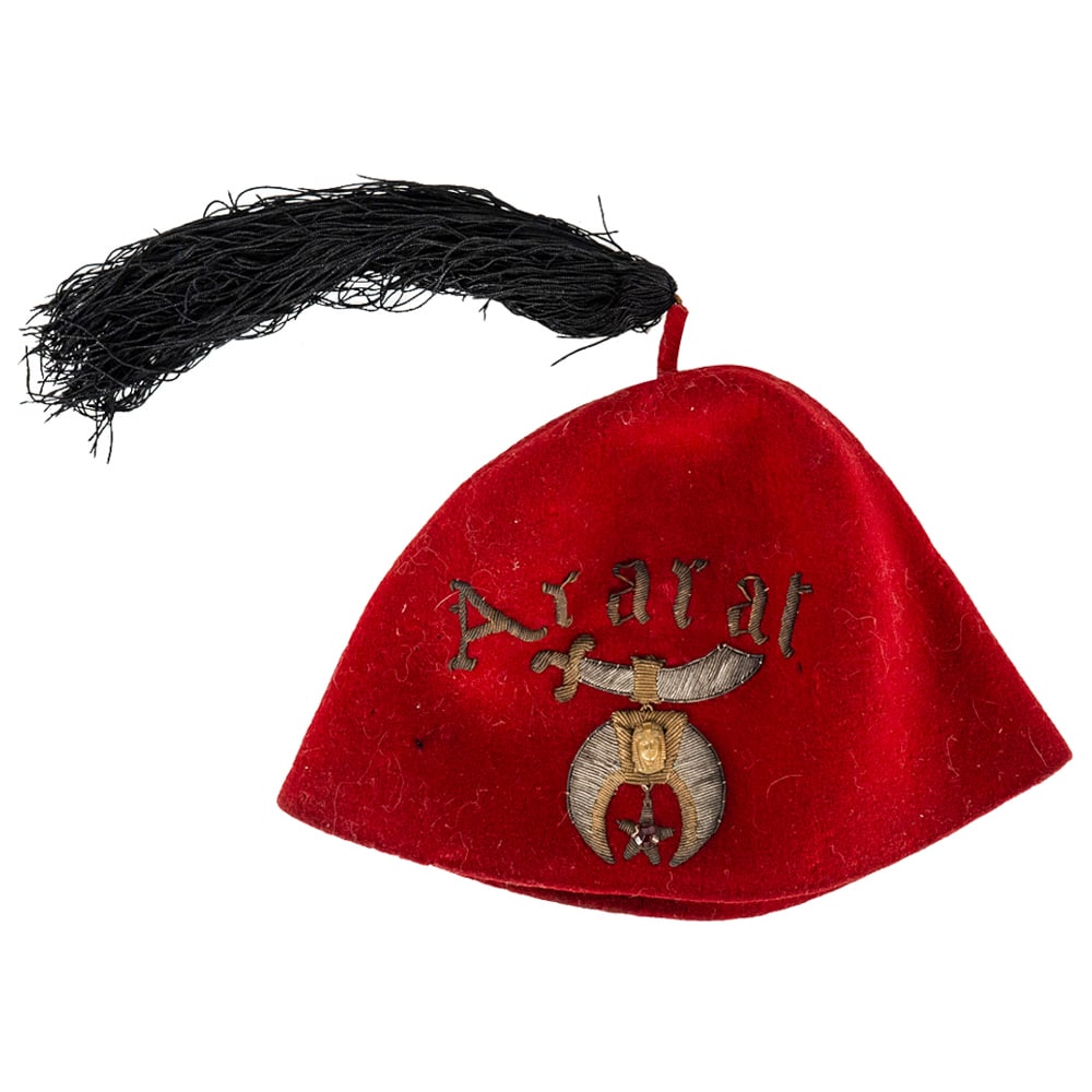 Masonic Wool Hat by M J Gelhaar: DESCRIPTION: Masonic hat by M.J. Gelhaar of Kansas City Missouri. Composed of red wool and silk tassel, with silver and gilt embroidery. Original manufacturer label at interior. CIRCA: Late 19th to Ea