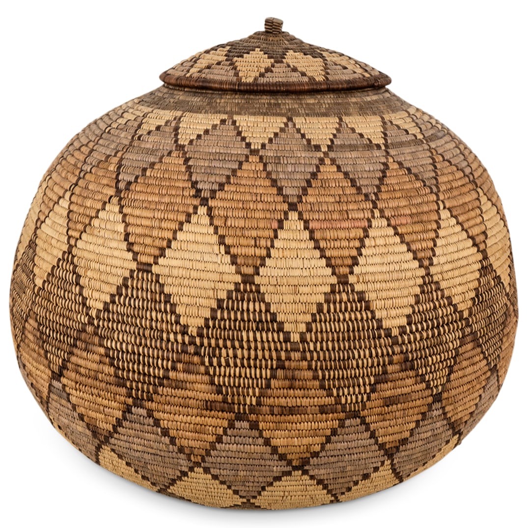 Zulu Woven Basket: DESCRIPTION: Zulu woven basket featuring diamond motif. ORIGIN: Zulu DIMENSIONS: H: 15.5" Diameter: 17.5" - CONDITION: Great condition. See lot description for details on item condition. More detailed