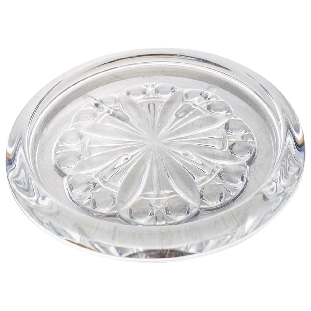 Baccarat Crystal Wine Bottle Coaster: DESCRIPTION: Baccarat crystal wine bottle coaster in rounded form decorated with cut motifs on the underside. Marked with "Baccarat" hallmark on the underside. CIRCA: 20th Century. ORIGIN: France DIME