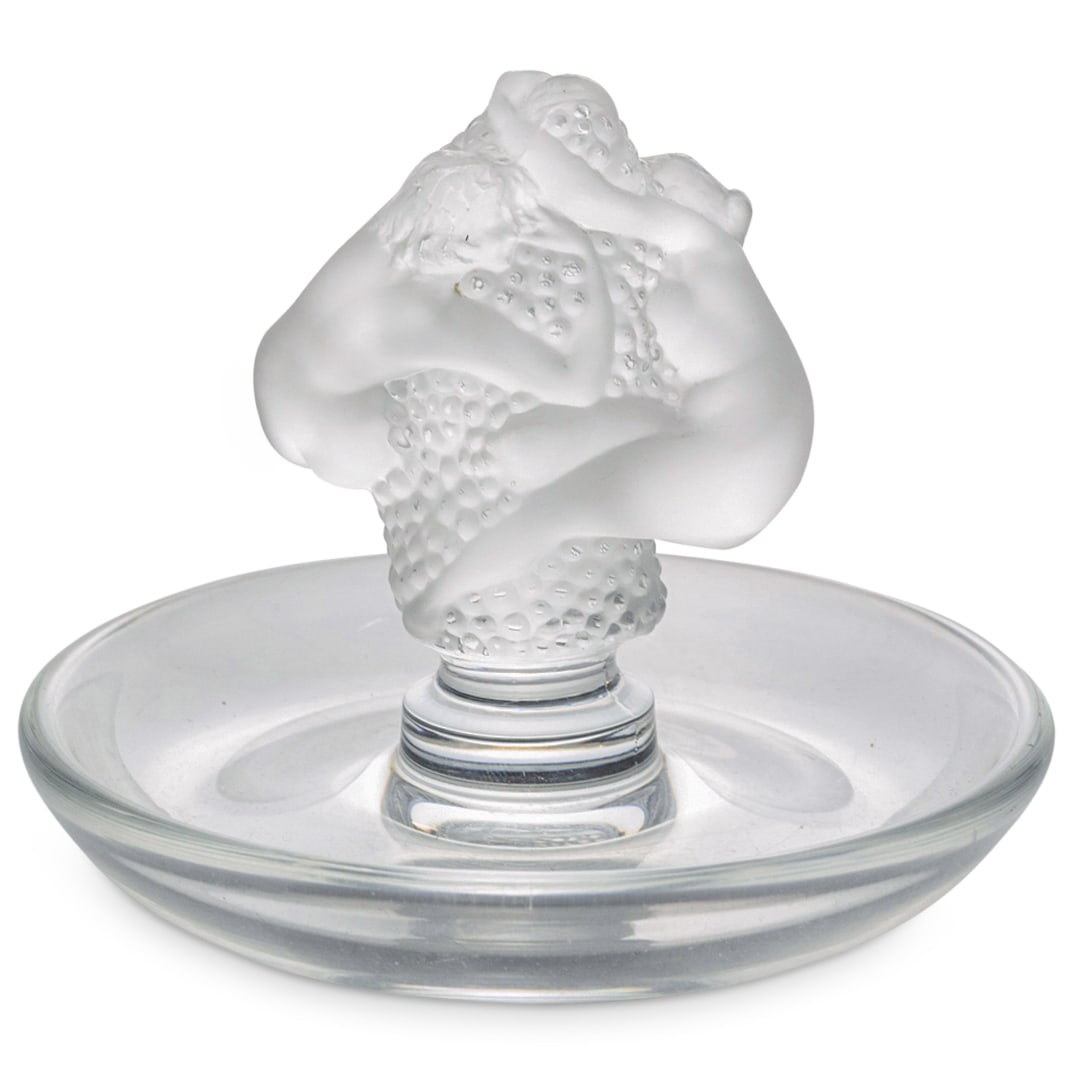 Lalique "Roxane" Round Pin Tray Dish: DESCRIPTION: Lalique crystal "Roxane" round pin tray dish. Depicting frosted figurative motif, with pair of nude female figures. Marked with "Lalique" etched signature hallmark. CIRCA: 20th Century OR