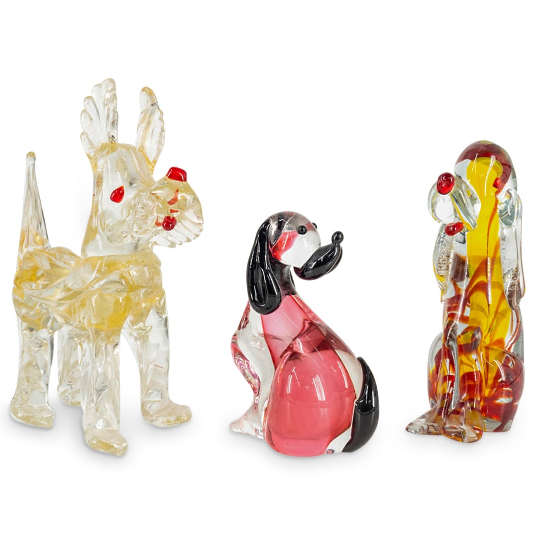 (3 Pc) Murano Glass Dogs: DESCRIPTION: Murano glass sculptures, each depicting a dog in a different pose: one standing with gold flake accents, one seated and looking forward with silver flake accents, and one seated and looki