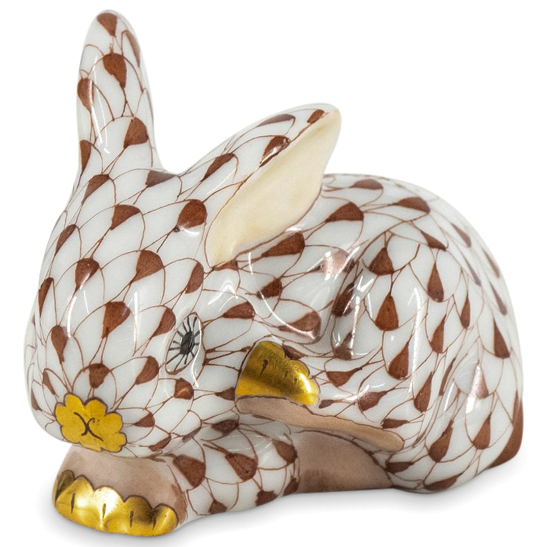 Herend Porcelain "Scratching Bunny" Chocolate Fishnet Figurine: DESCRIPTION: Herend porcelain figurine of a "Scratching Bunny" embellished in a chocolate brown hued fishnet pattern. Finished with gilded accents. Style: #15582. Marked along the underside with Heren