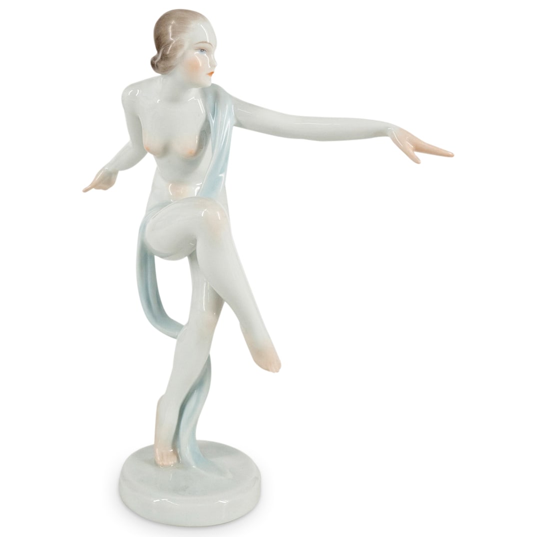 Herend Nude Dancer Porcelain Sculpture: DESCRIPTION: Herend Art Deco-style polychrome porcelain sculpture depicting a nude female dancer. Hallmarked on underside. CIRCA: Mid 20th - Early 21st Century ORIGIN: Hungary DIMENSIONS: H: 8.5" W: 5