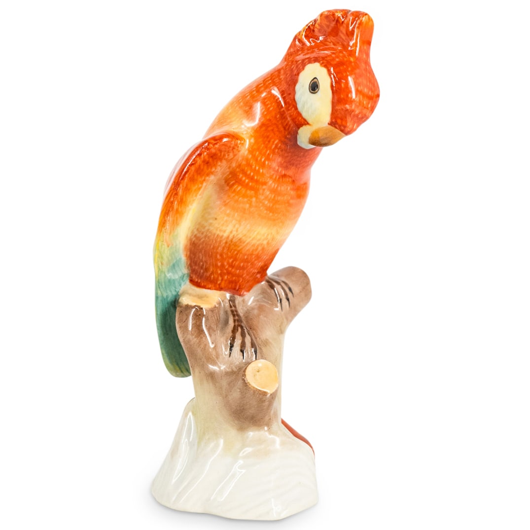 Herend Porcelain "Cockatoo" Figurine: DESCRIPTION: Herend Porcelain "Cockatoo" Figurine. Model number #5009. Depicts a parrot bird perched on a tree branch. Marked with Herend hallmark. CIRCA: 20th Century ORIGIN: Hungary DIMENSIONS: H: 5