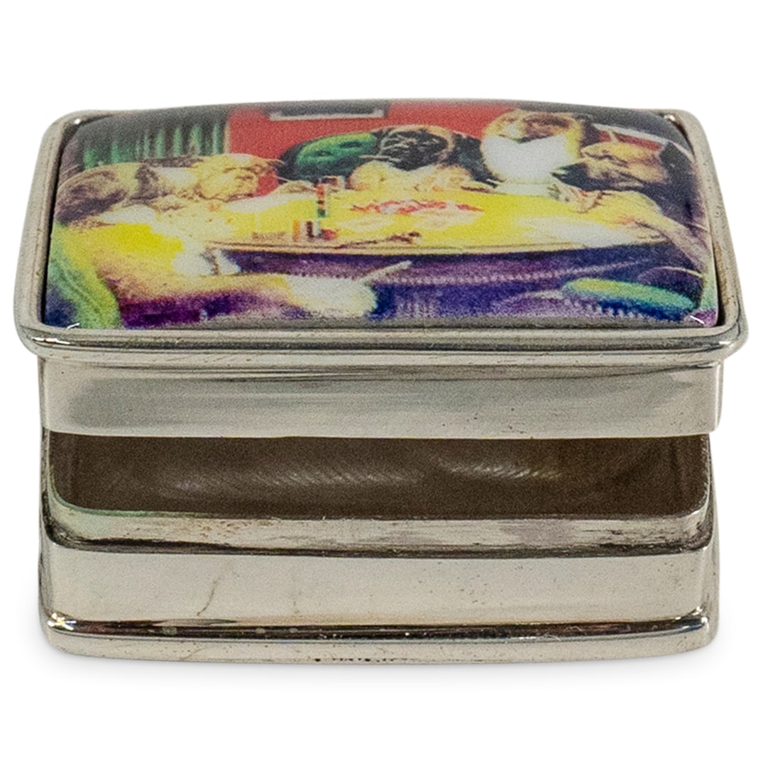 Sterling Silver "Dogs Playing Poker" Pill Box: DESCRIPTION: A Sterling Silver "Dogs Playing Poker" Pill Box. A sterling silver pill box decorated along the lid with the famous depiction of dogs playing cards. Marked "Sterling". CIRCA: 21st Century