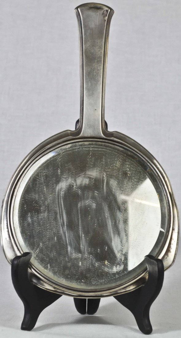 Antique sterling silver ladies mirror: DESCRIPTION: Antique engraved sterling silver beveled mirror for ladies. No hallmarks but tested silver CIRCA: 19th ct MADE IN: N/A DIMENSIONS: H:10.5" L:6"