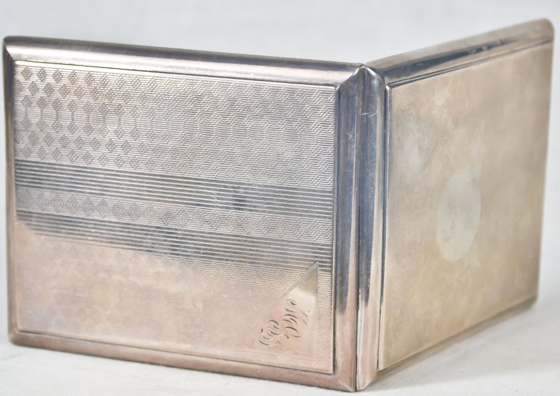 Antique engraved sterling silver card case: DESCRIPTION: Antique engraved sterling silver card case. Hallmarked sterling on the inside, initialed on the top left corner. Weighs 2.6 ounces CIRCA: 1880-1920s MADE IN: USA DIMENSIONS: H:2.5" L:3.25