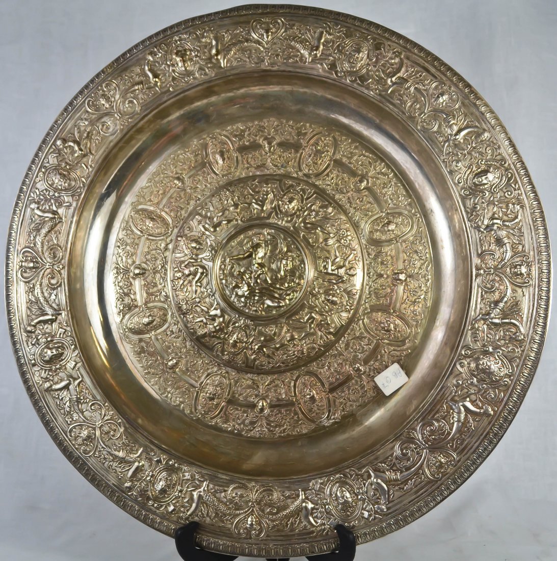 Antique silver over copper by Elkington charger: DESCRIPTION: Antique baroque silver over copper by Elkington charger, designed The wimbledon ladies tennis trophy. CIRCA: 1870s MADE IN: England DIMENSIONS: 18" in diameter
