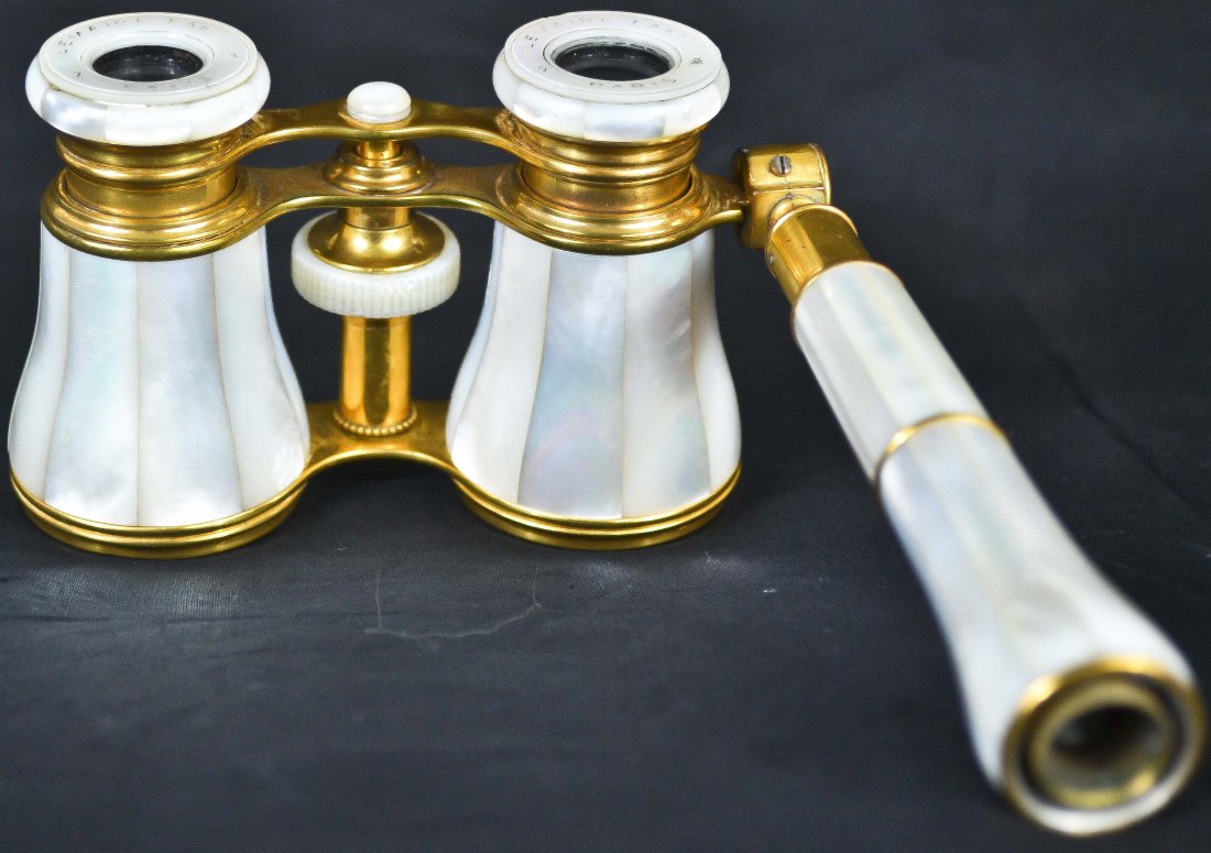 Victorian mother of pearl operah glasses: DESCRIPTION: Victorian metal and mother of pearl operah glasses with mother of pearl handle. Hallmarked Lemaire Fabe Paris CIRCA: 1900s MADE IN: France DIMENSIONS: L:4.25" H3.25" not including handle