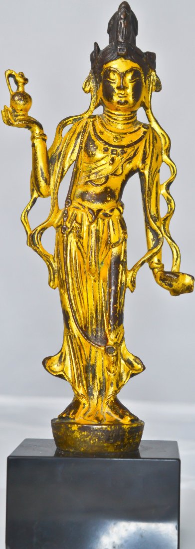 Antique Chinese dore bronze godess statue: DESCRIPTION: Antique Chinese doree bronze godess statue on a black marble base CIRCA: 18th/19th ct MADE IN: China DIMENSIONS: H:11" L:4"