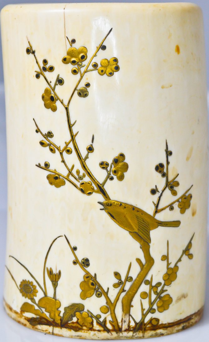 Antique piece of ivory tusk with gold overlay: DESCRIPTION: Antique piece of ivory tusk with bird and floral gold overlay CIRCA: 19th ct MADE IN: China DIMENSIONS: H:5" 3" in diameter