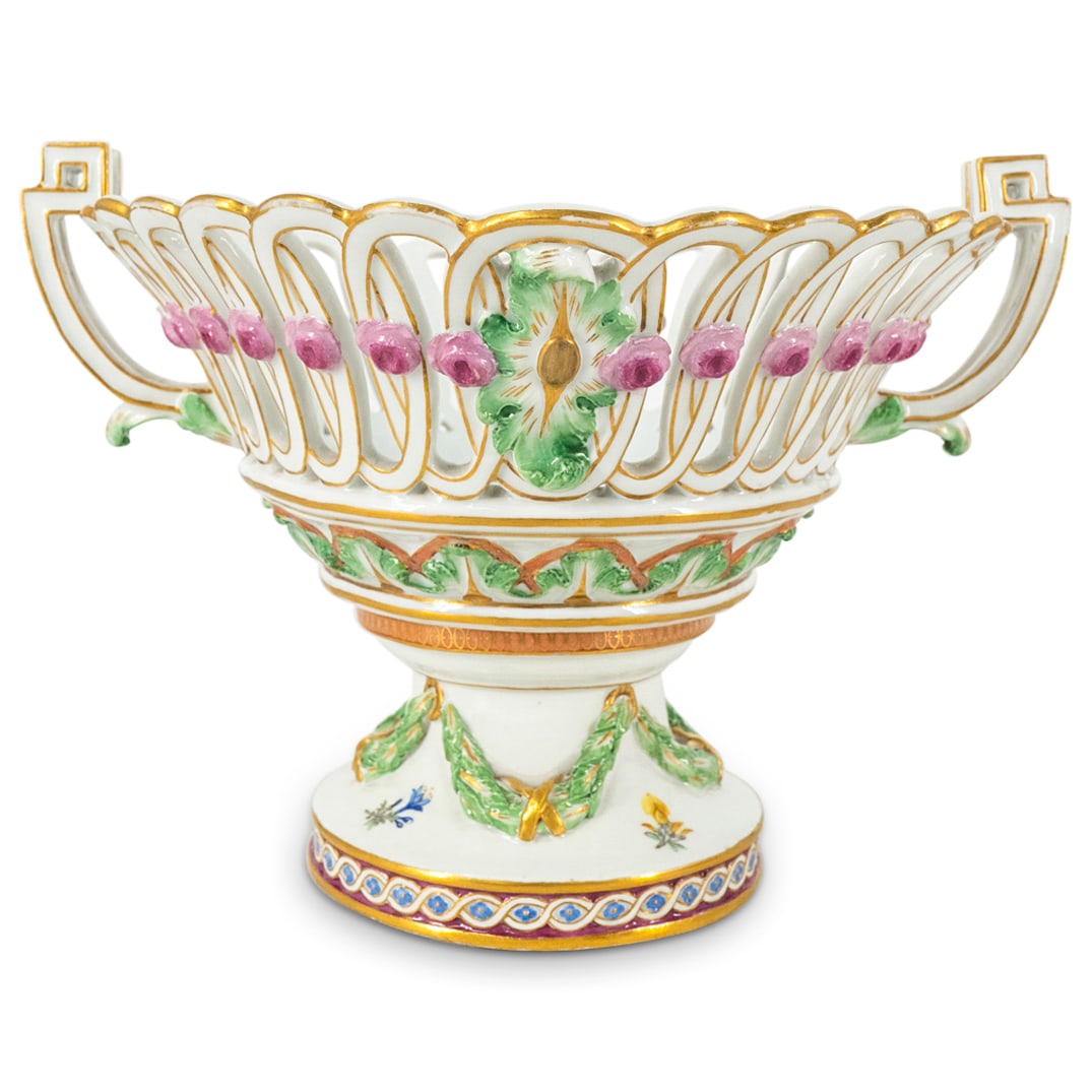 Antique Meissen Porcelain Centerpiece Bowl: DESCRIPTION: Antique Meissen porcelain centerpiece bowl featuring polychrome hand painted floral and foliage motifs, openwork and gilt accents. Hallmarked on underside with crossed swords mark, star a