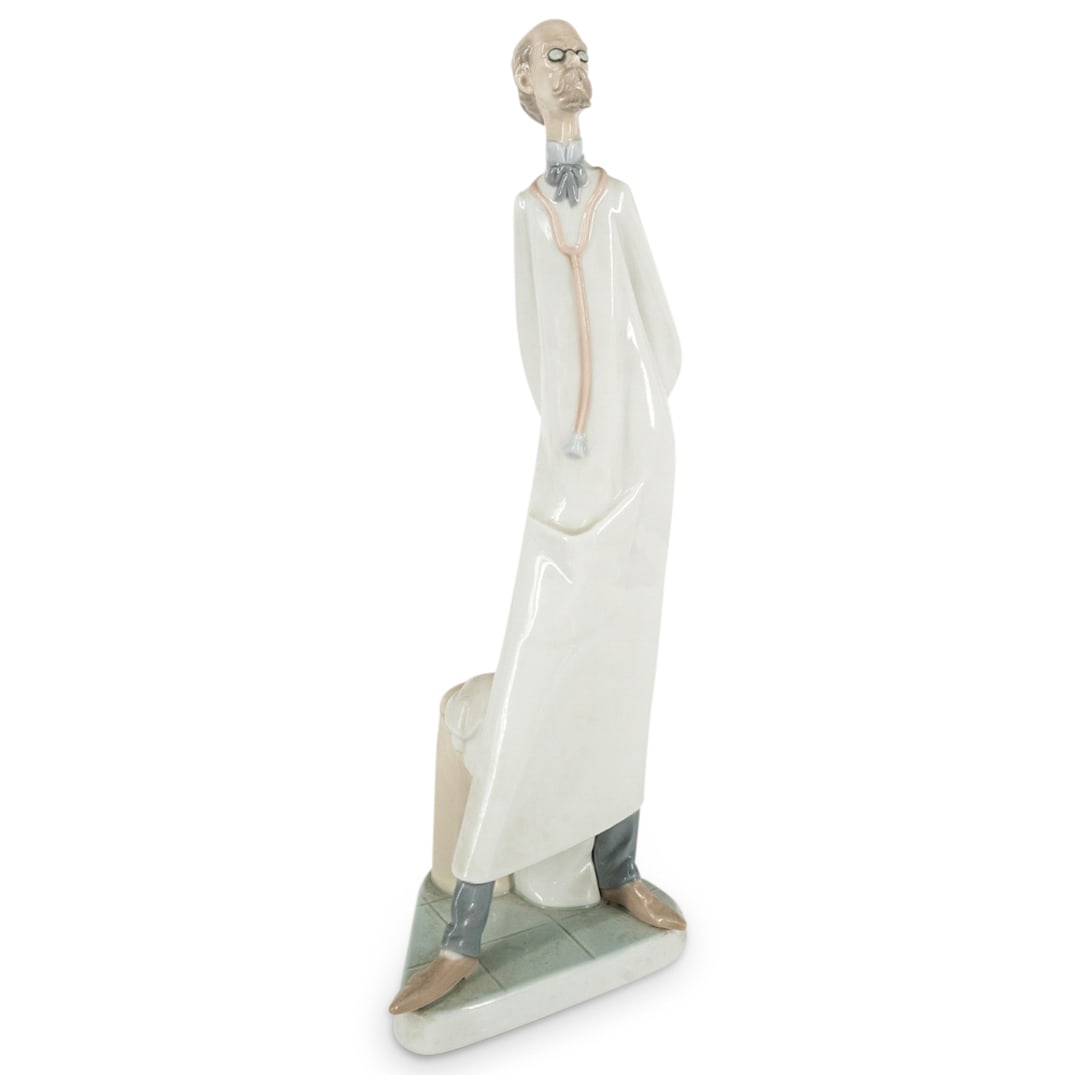 Lladro Professions Doctor Porcelain Figurine: DESCRIPTION: Lladro porcelain figure, #4602, depicting a doctor. Hallmarked on underside. CIRCA: Late 20th Century ORIGIN: Spanish DIMENSIONS: H: 14.25" W: 5.25" L: 4.25" CONDITION: Great condition.